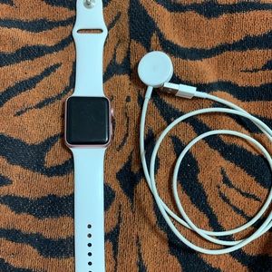 Series 2 Apple Watch w/ charger and 9 bands